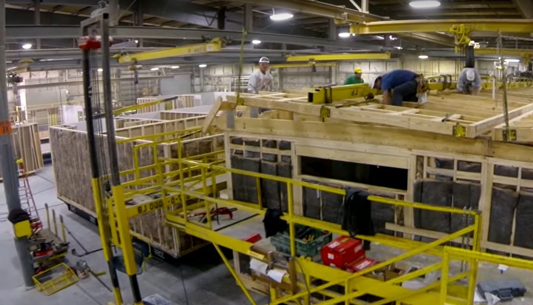 The interior of our manufacturing facility showing modular homes being built.